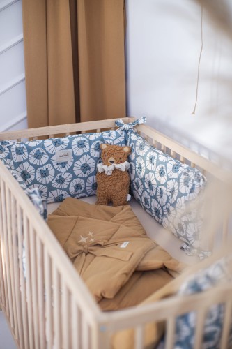 Ochraniacz do łóżeczka 70x140 cm w niebieskie lwy